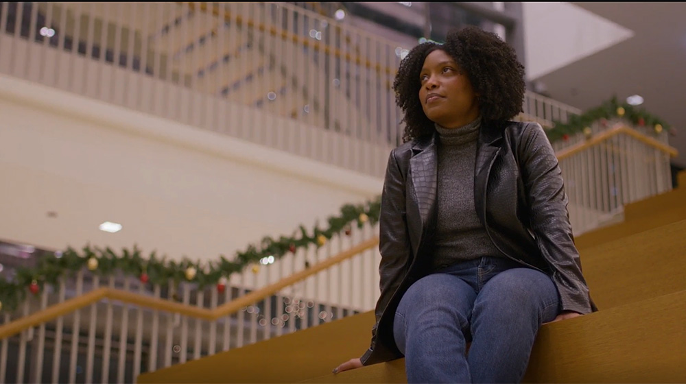 Akilah Blackman sits and looks out from the great stairs Akilah Blackman sits and looks out from the great stairs